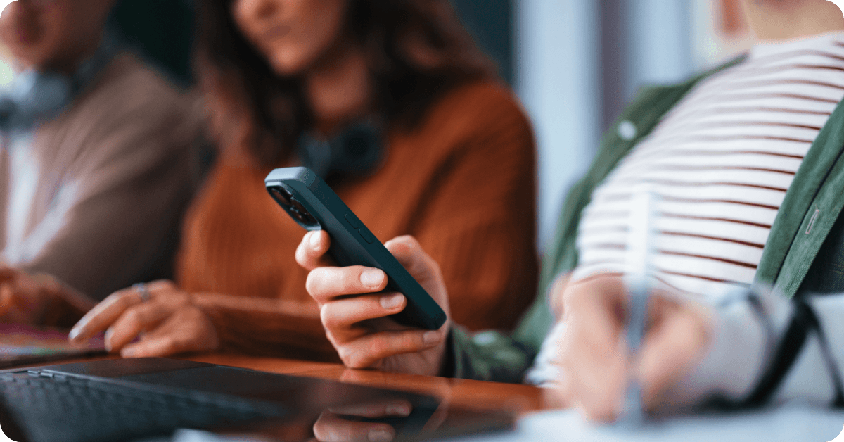A nonprofit organization worker using her phone