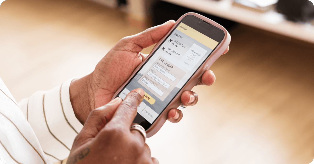 A traveler is booking a layover flight on their smartphone.