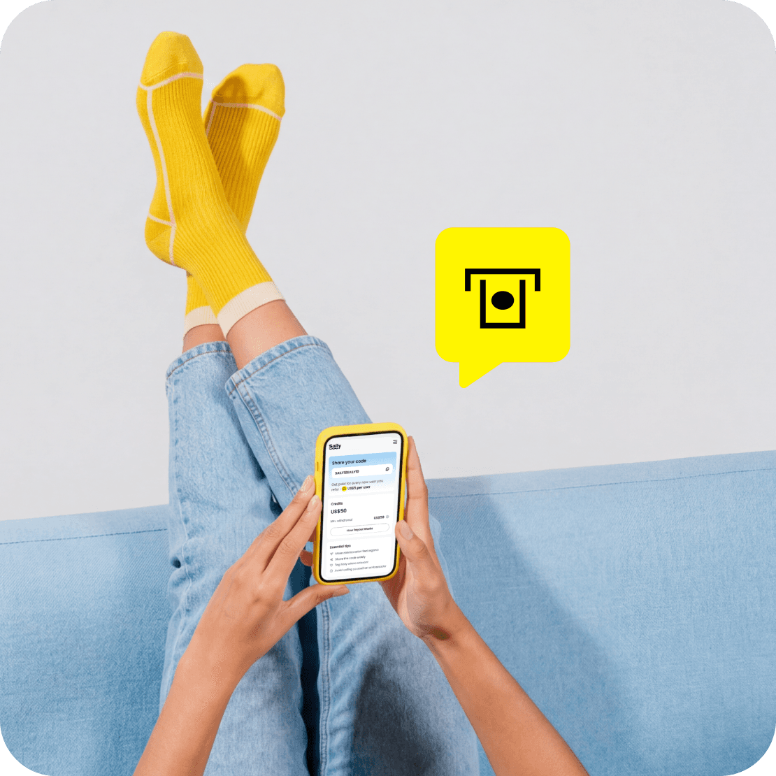 A person relaxing with legs up while browsing the Saily app on their phone. A “Cash-out” icon overlay.