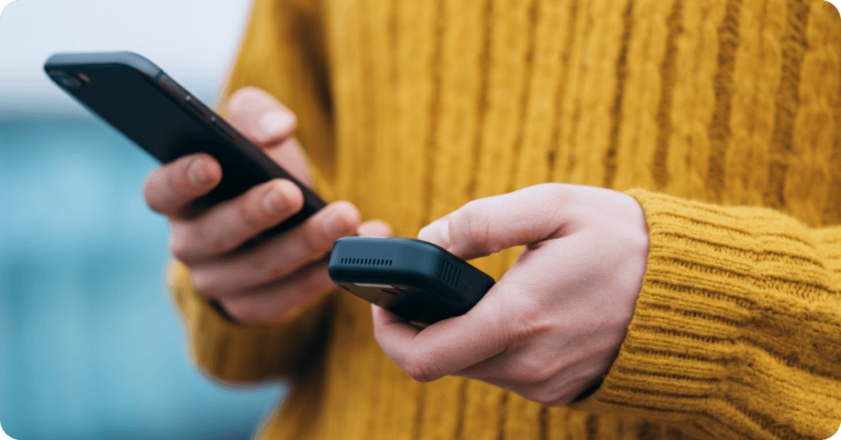 Person with cellphones in their hands