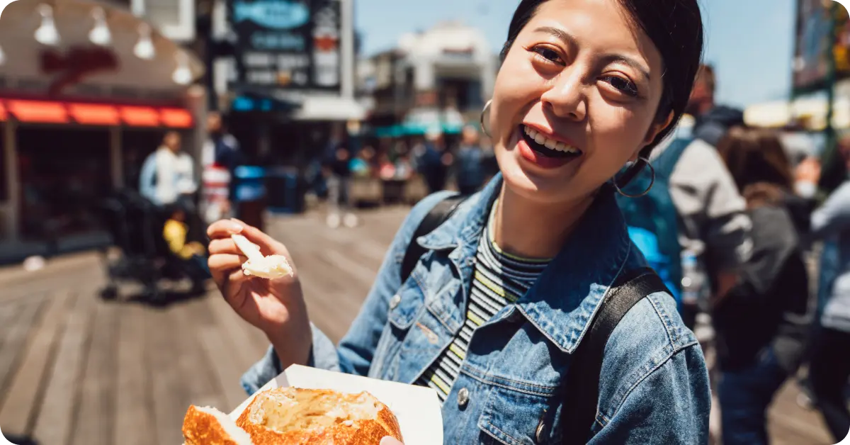A woman enjoying street food in San Francisco