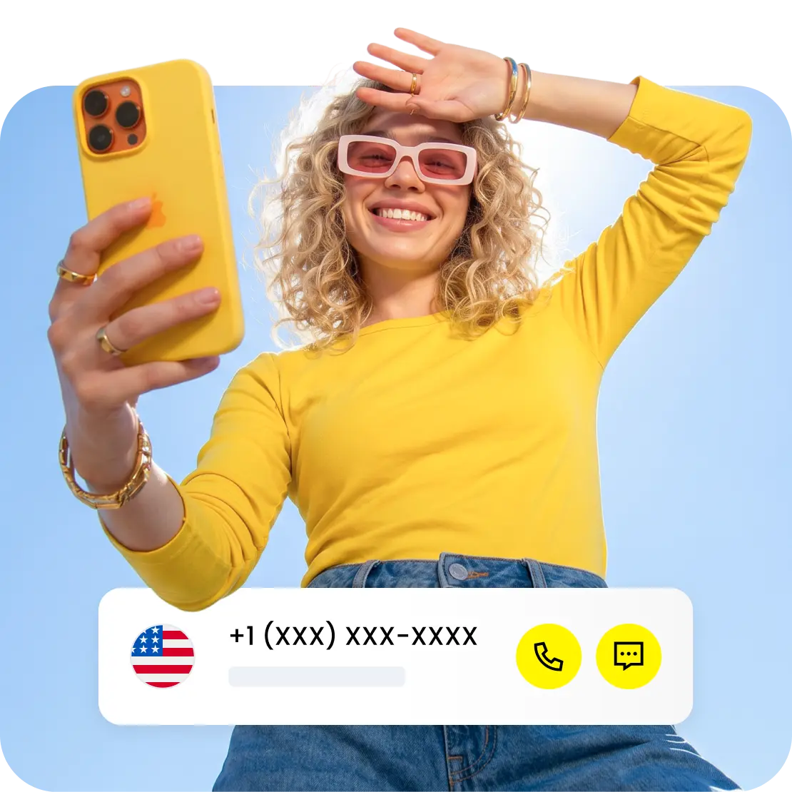 A smiling person looking at their phone.