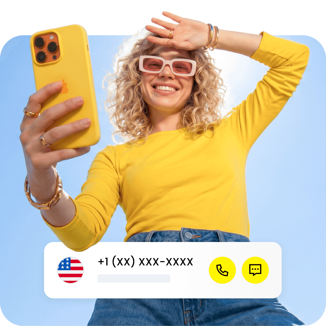 A smiling person looking at their phone.