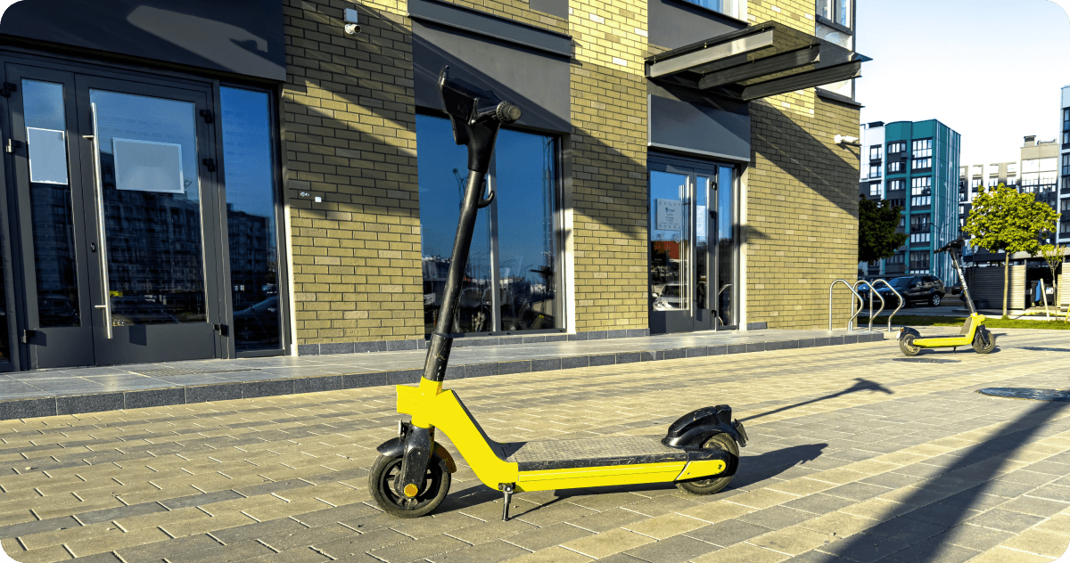 An e-scooter is parked on the street.