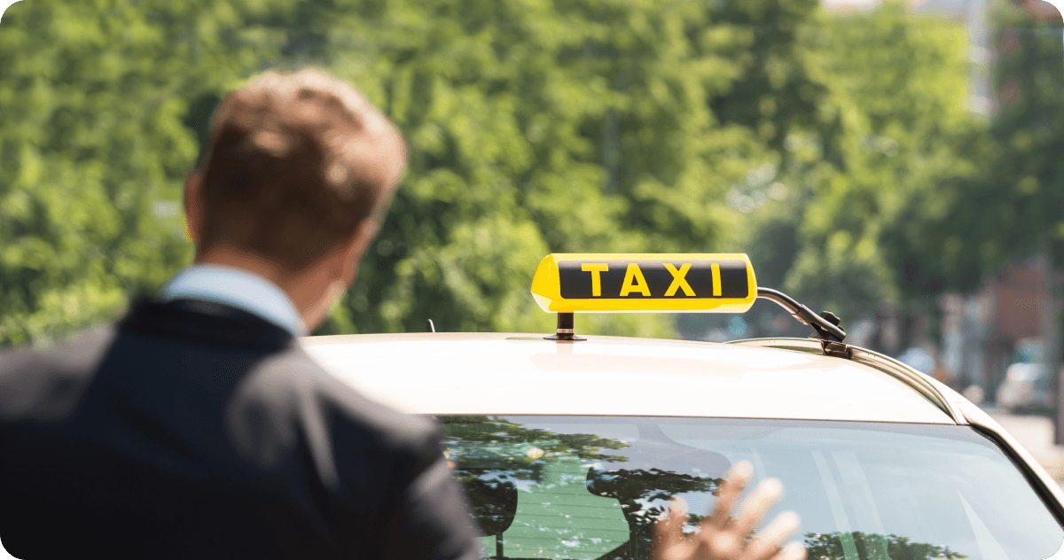 A man is hailing a taxi.