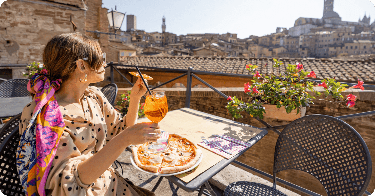 A woman sitting around outside an Italian restaurant