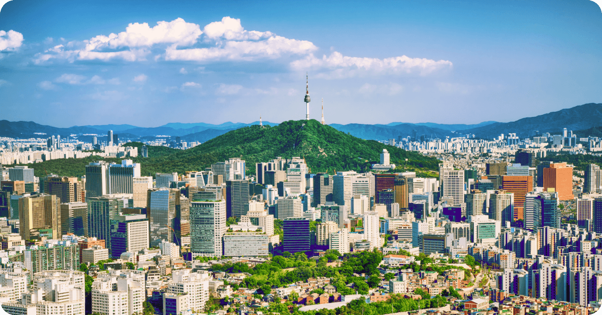 A panoramic view of the Seoul, South Korea, skyline, featuring the prominent N Seoul Tower situated atop Namsan Mountain.