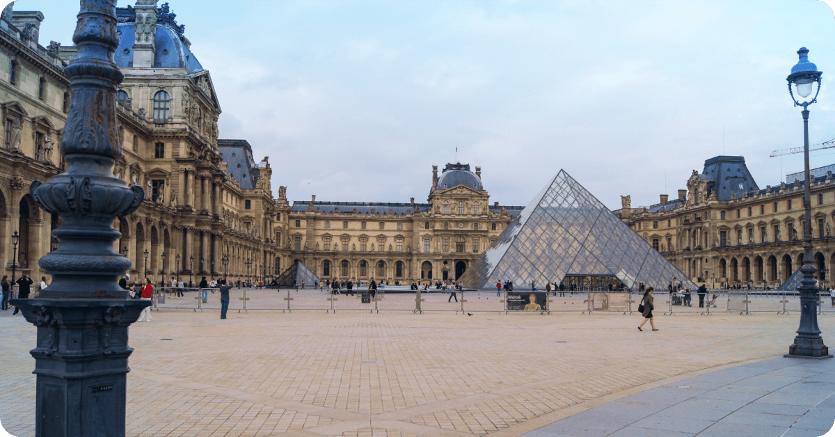 Tourists visit the Louvre Museum in Paris.