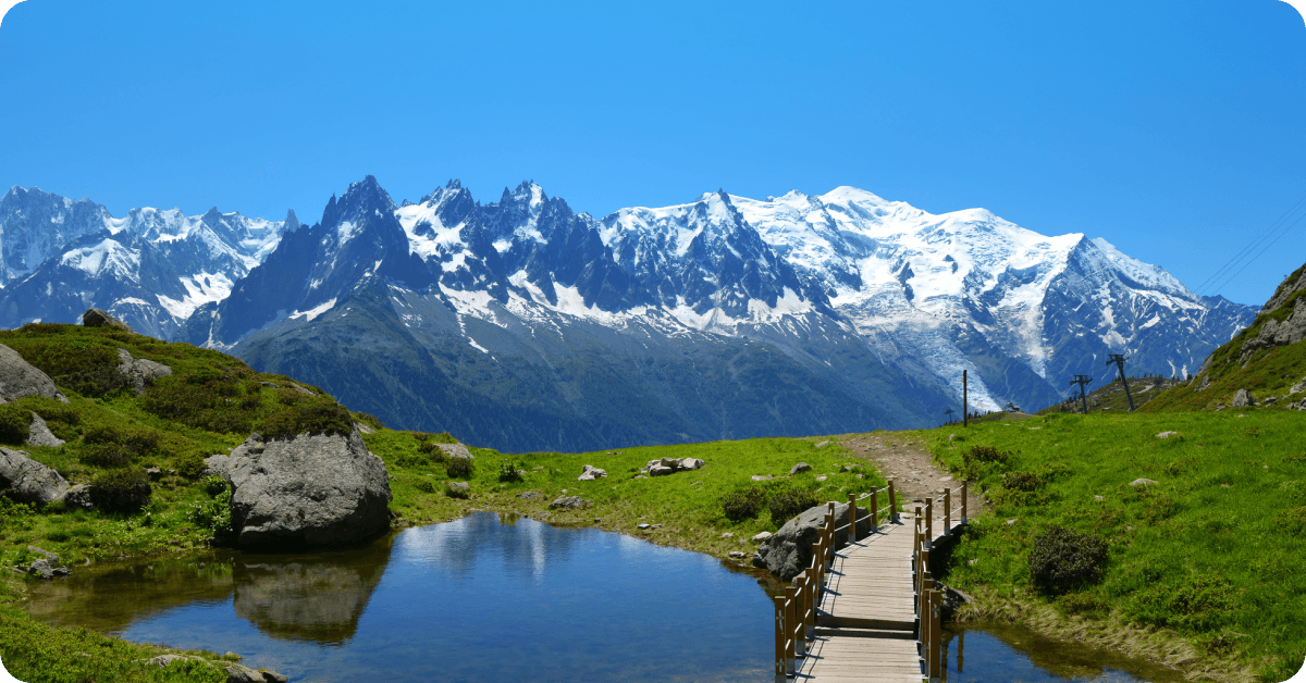 The French Alps are reflected in a lake.