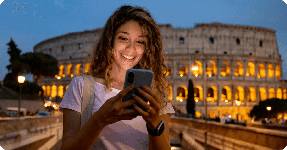 A person using a phone in Rome, Italy.
