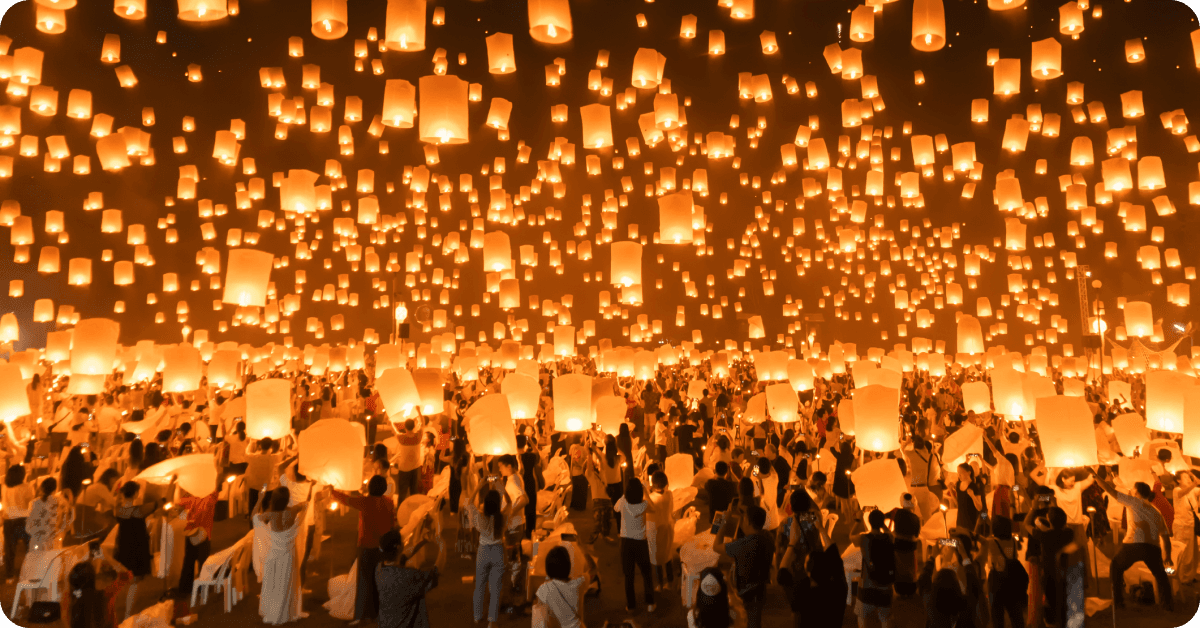 People celebrating Yi Peng festival in Thailand.