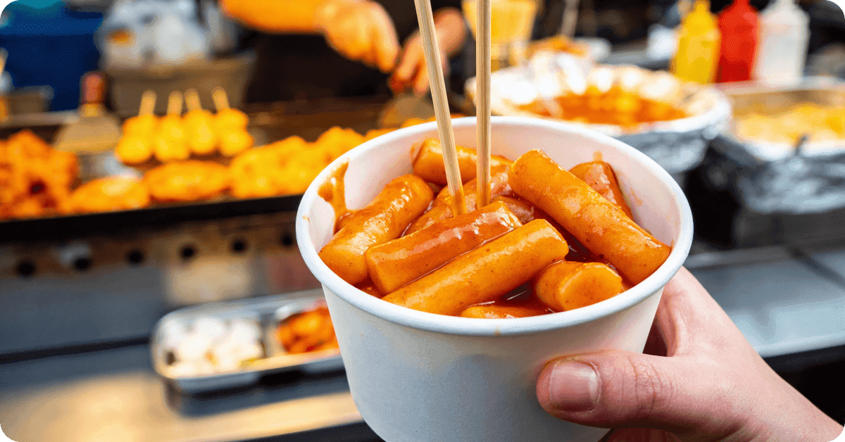 A person eating tteokbokki.