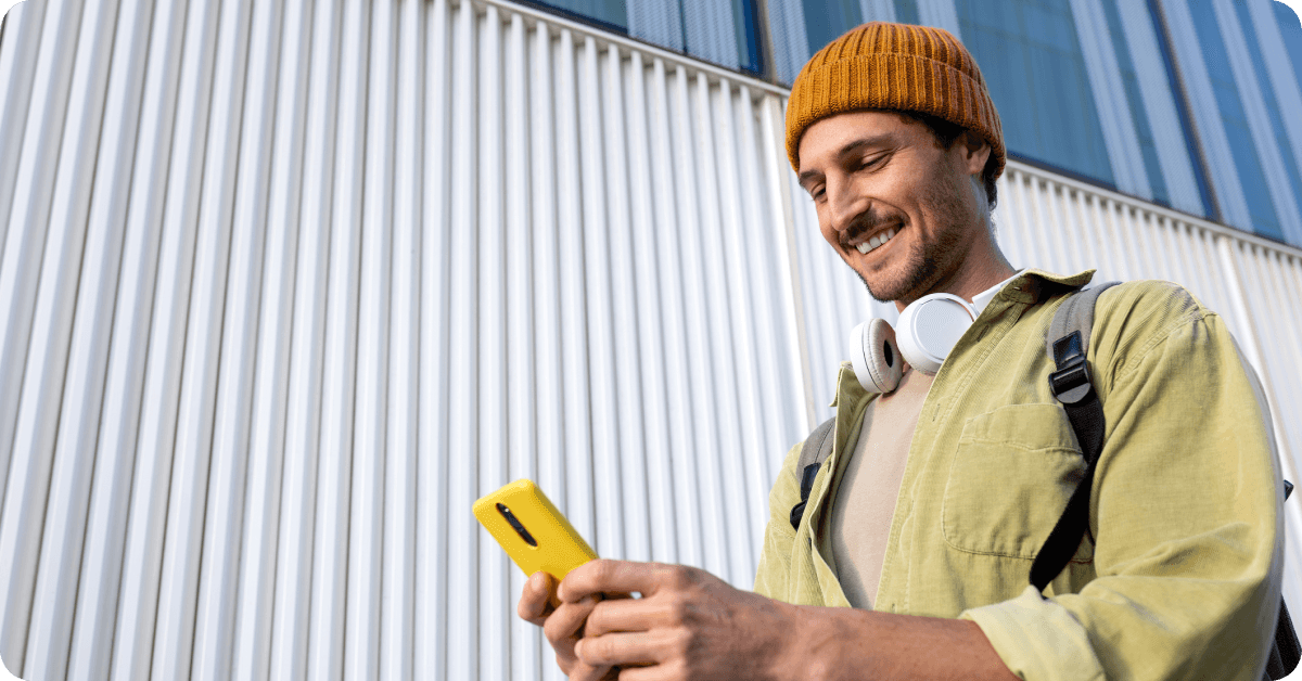 A student is looking at his smartphone.