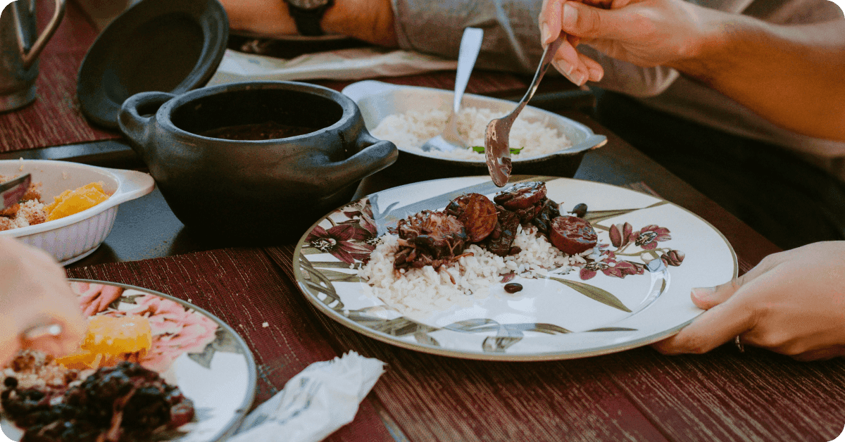 A person eating feijoada.