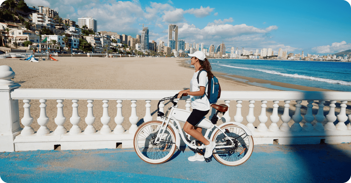 A woman cycling around Benidorm.